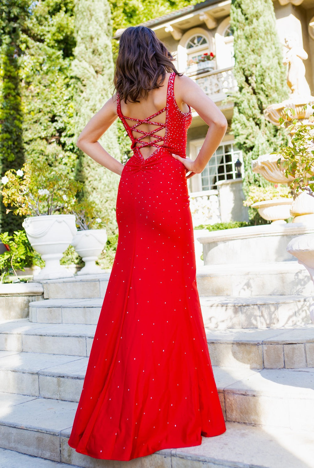Glittering two-tone rhinestones adorn a stretch gown-smcdress