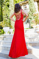 Glittering two-tone rhinestones adorn a stretch gown-smcdress