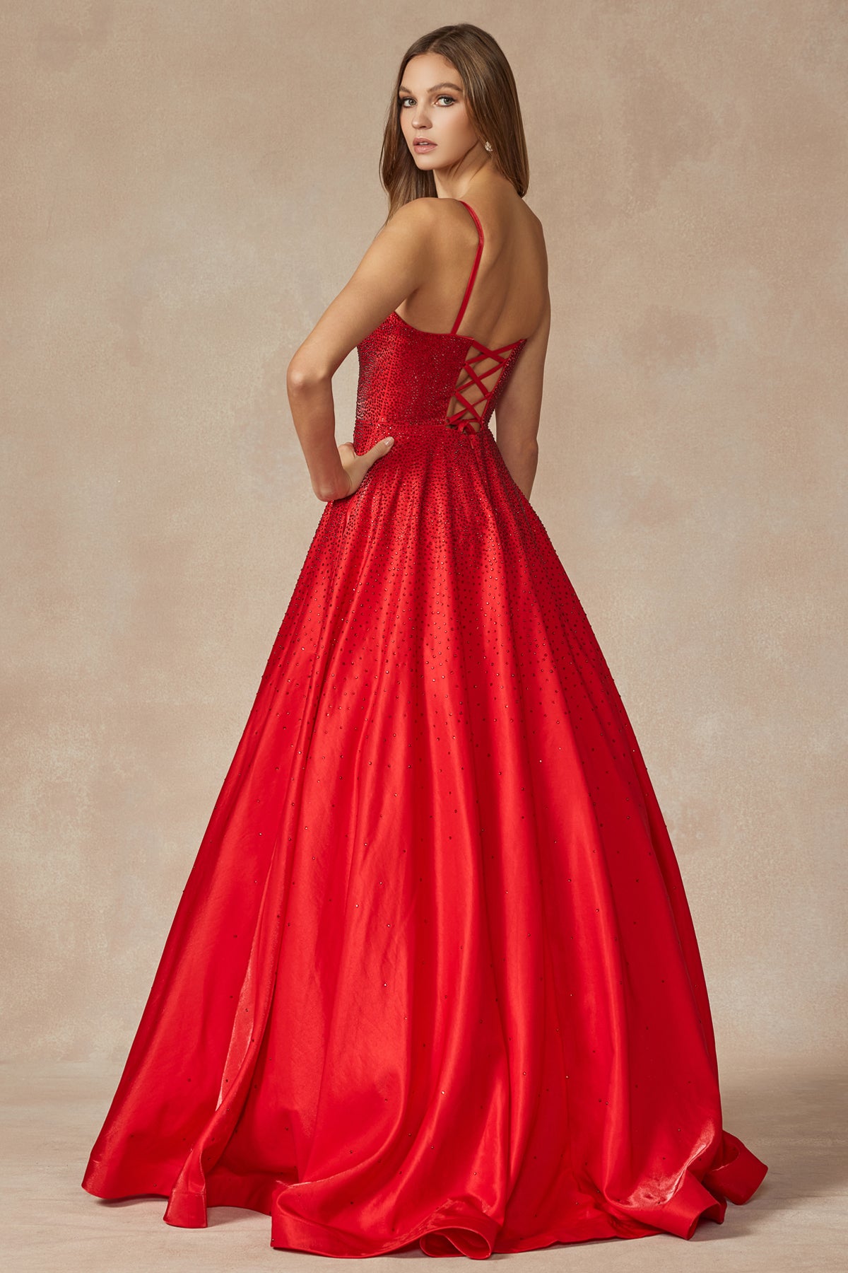 Back of red prom gown with stone accents
