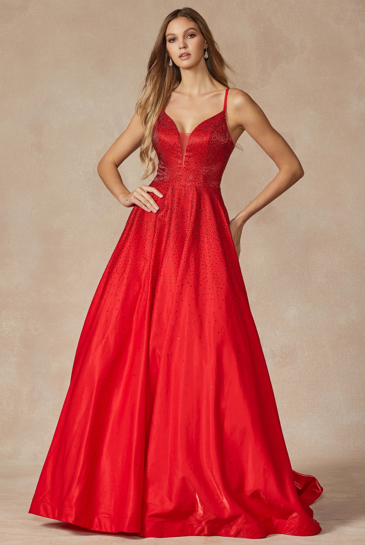 Red prom gown with stone accents