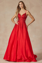 Red prom gown with stone accents