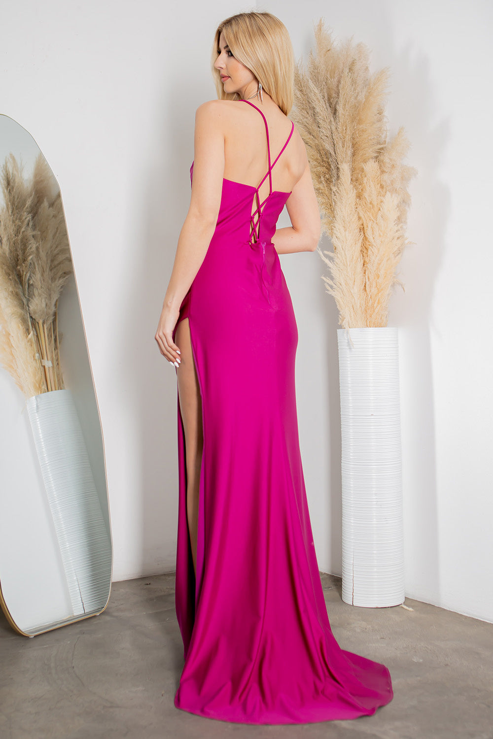 back of fuschia corset style prom dress